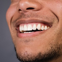 Closeup of smiling patient with dental implants in Westhampton 