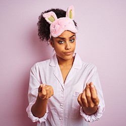 tired woman making hand gestures about money