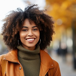 woman standing outside and smiling