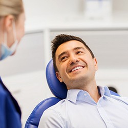 man smiling after understanding the cost of dentures in Westhampton