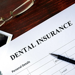 Dental insurance paperwork for the cost of dental implants in Westhampton 