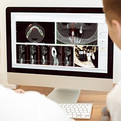 Dentist looking at dental technology