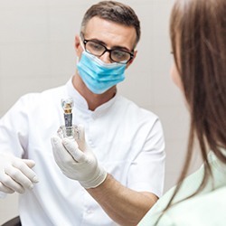 Westhampton implant dentist describing dental implants to patient