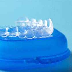 Invisalign clear aligner on top of the case instead of Smile Direct Club