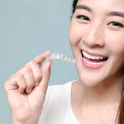patient who is excited about the ways to make Invisalign affordable