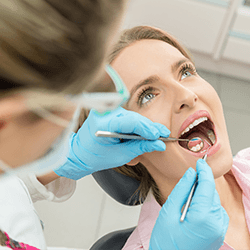 Woman receiving dental exam