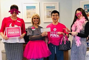 Beach Dental team dressed up from breast cancer awareness month