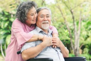 older couple hugging and smiling