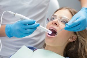 images being taken in a woman’s mouth with an intraoral camera