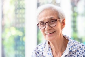 smiling elderly person with good senior oral health