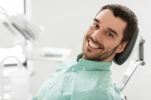 happy man with successful dental implants