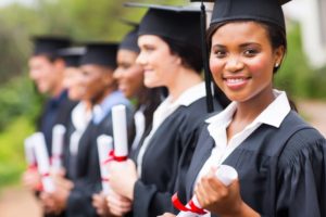 graduating seniors in line smiling